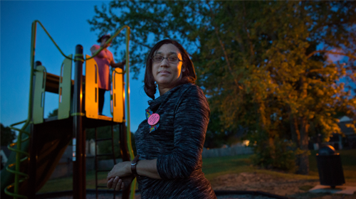 Krystal Polk while her daughter, Krystin, has fun on the playground