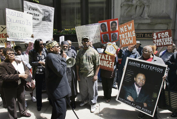 A group of demonstrators rally outside Chicago's City Hall, Tuesday, April 24, 2007