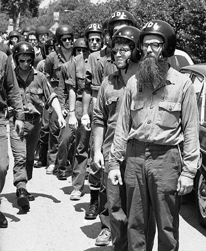Clad in paramilitary gear and helmets, members of the Jewish Defense League arrive on Monday, July 5, 1977 in Chicago suburb of Skokie for an anti-Nazi demonstration. 