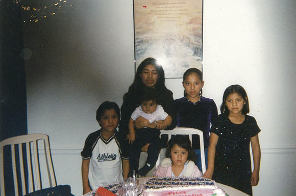 Jessica Colotl as a child with family at a birthday party