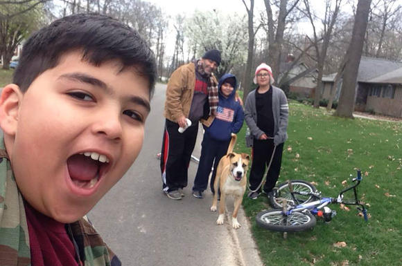 Maysoon’s son Moody (Mohamed). In the background is her husband Ihsan, and other two sons Omar and Ali with their dog Scout.