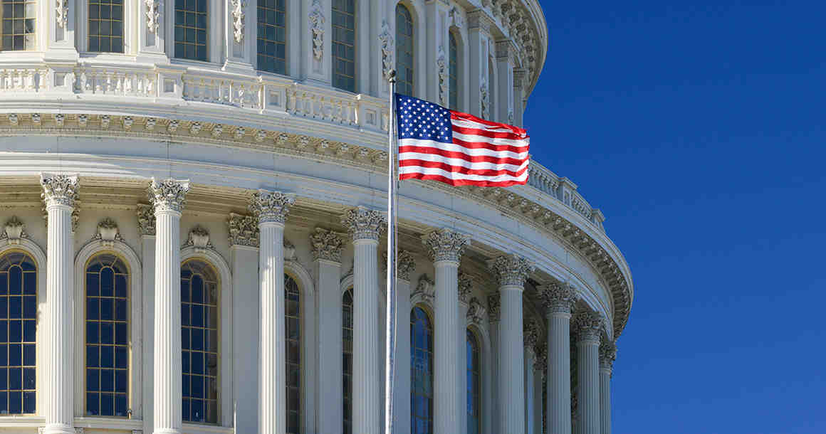 US Capitol Building with flag flying