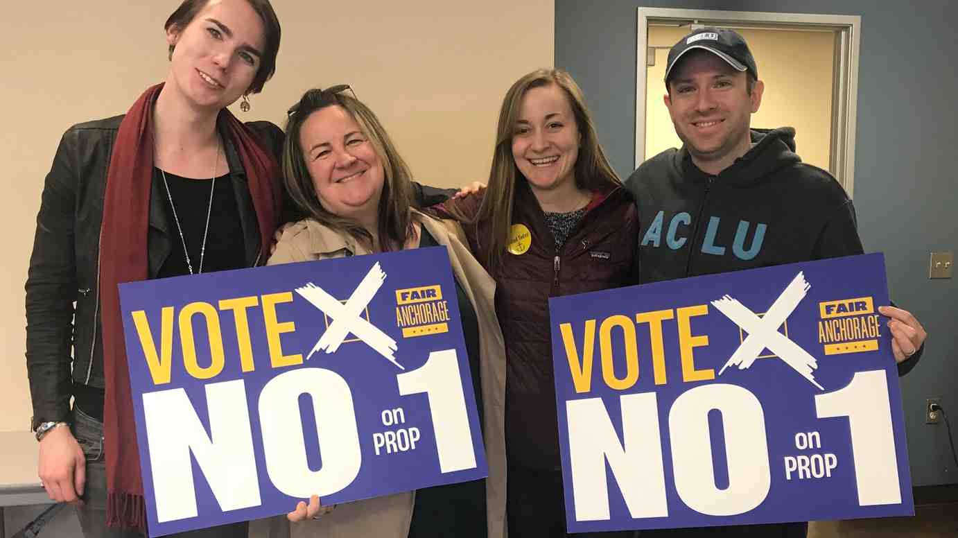 From left: Lillian Lennon (Transgender Community Organizer, ACLU of Alaska); Liz Welch (ACLU); Kati Ward (Fair Anchorage Campaign Manager); Joshua Decker (Executive Director, ACLU of Alaska). All holding "Vote no on prop 1 signs."