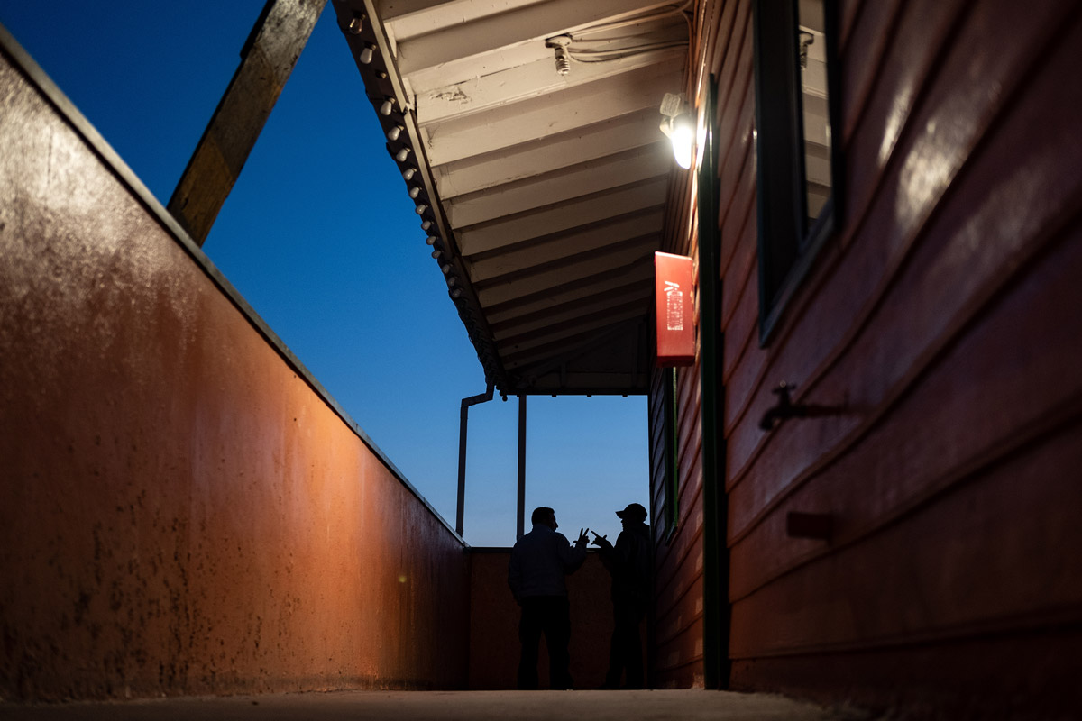 Two Asylum Seekers talking at Dusk