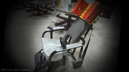 An empty prison restraining chair