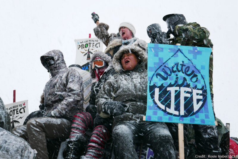 Water protectors and vets protest the Dakota Access Pipeline.