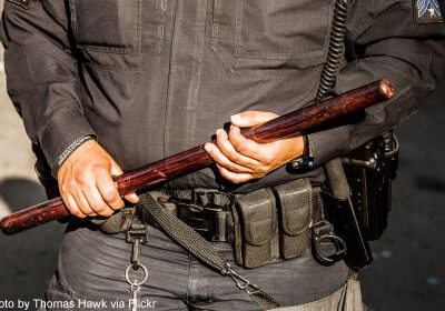 Photo of police officer holding nightstick