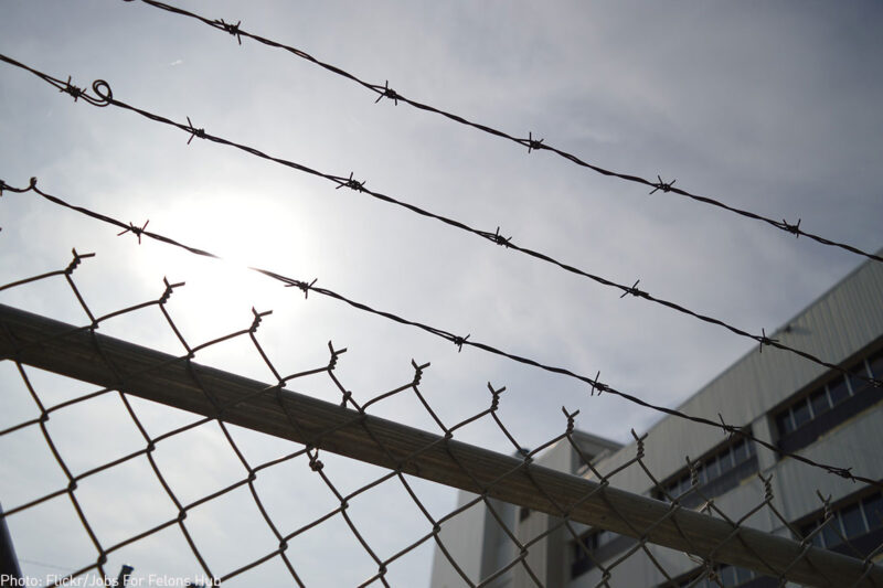 A barbed wire fence outside a prison