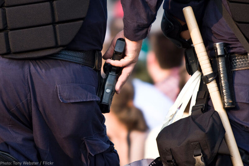 Police officer with hand on his gun