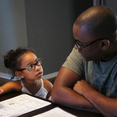 Father and daughter doing homework