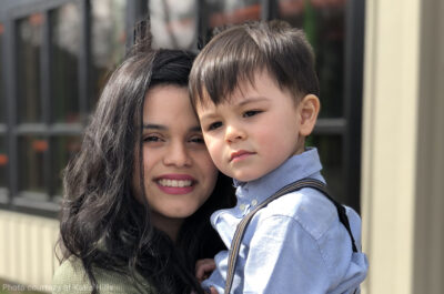 Plaintiff Katia Hills holds her son.