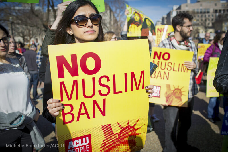 "No Muslim Ban" signs at a rally