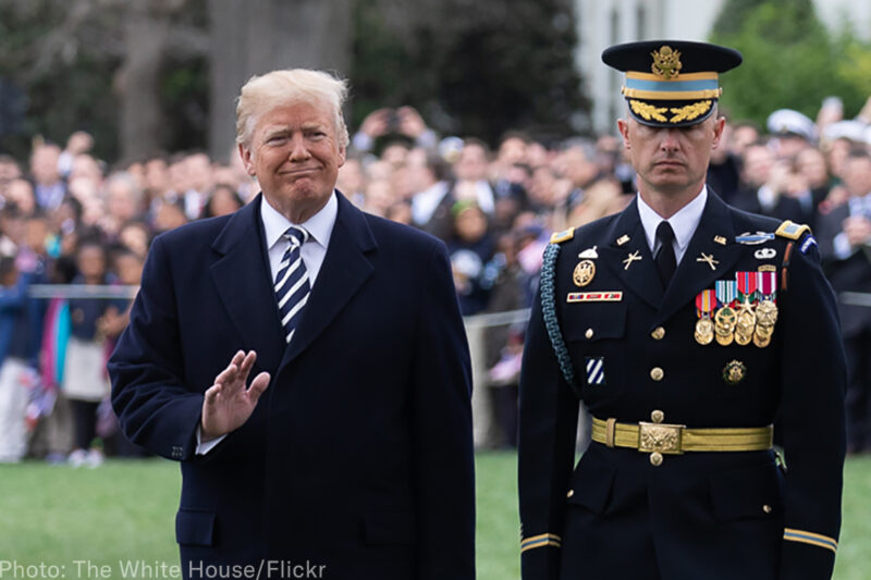 Trump and a member of the military