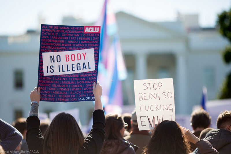 White Protest with poster: No Body is Illegal