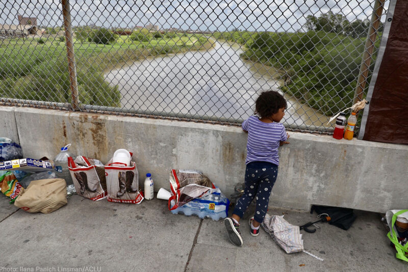 Girl standing on a bridge at the border