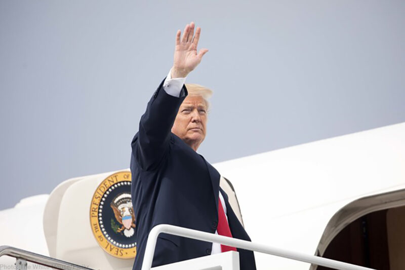 President Trump waving while boarding Air Force One