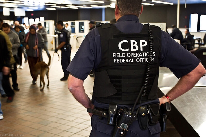 CBP officer watching pedestrian entrance