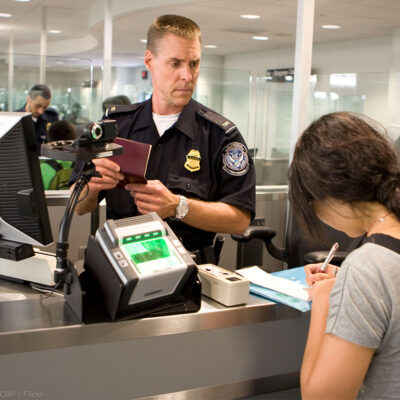 CBP Officer processes a passenger into the United States at an airport