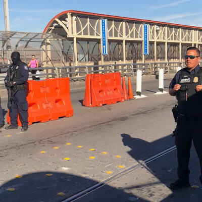 Border patrol officers on a bridge