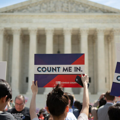 Demonstrators marching against adding a question regarding citizenship to the Census