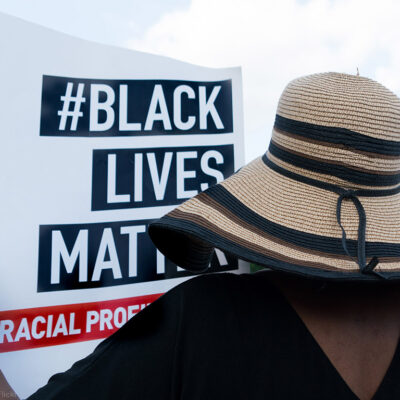 A protester holding a Black Lives Matter sign