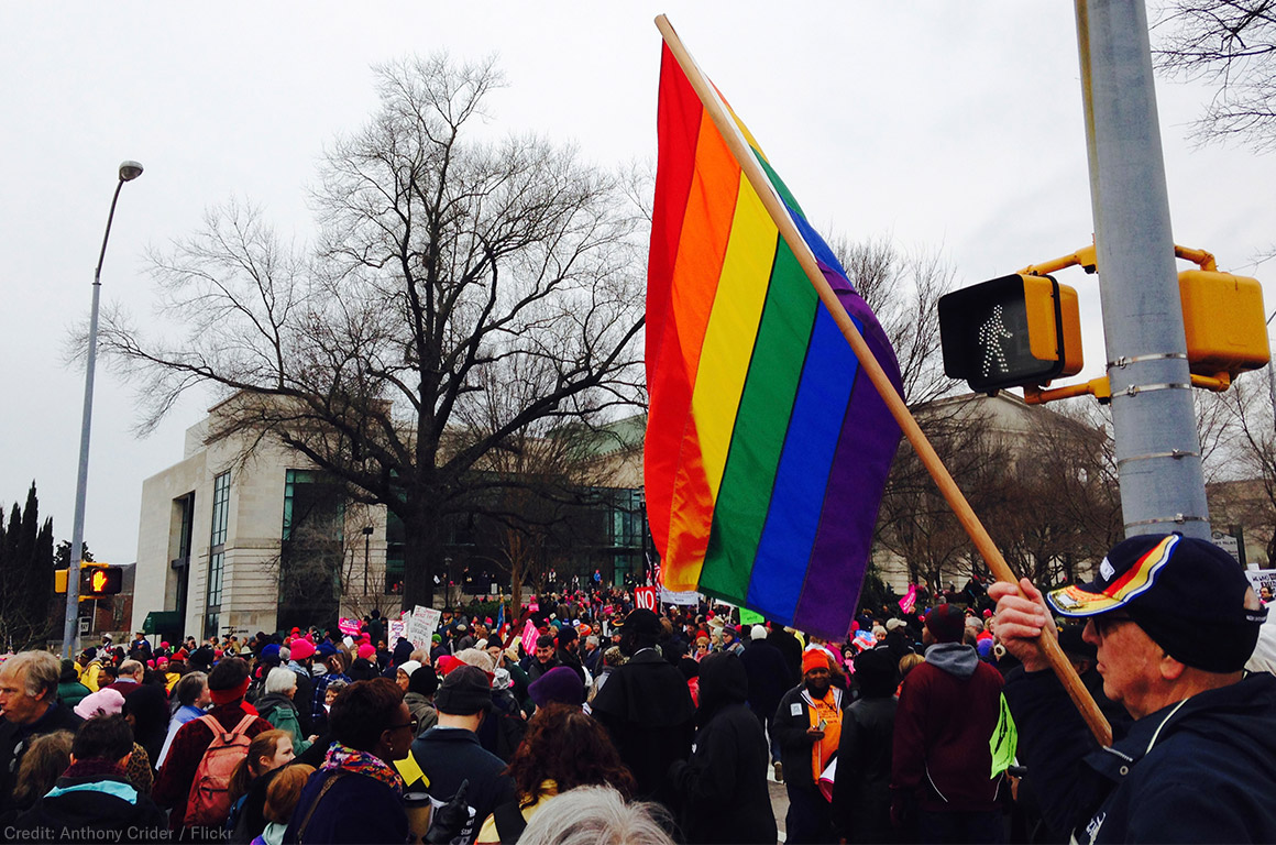 Moral March in Raleigh - Protester holding rainbow flag