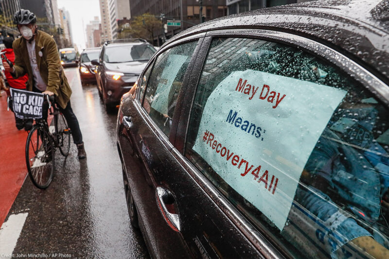 A caravan of May Day protestors drive up 2nd Avenue in New York City during COVID pandemic.