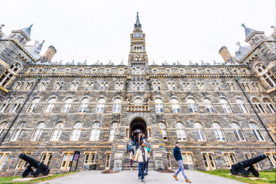 Students exiting a building on the Georgetown University campus.