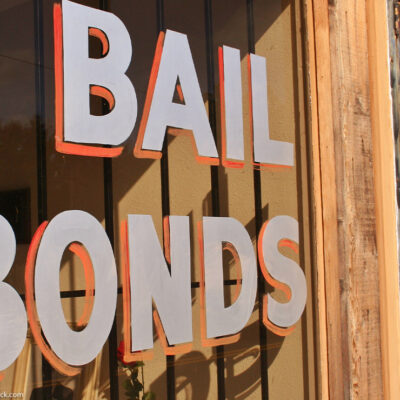 Window sign reads "bail bonds"