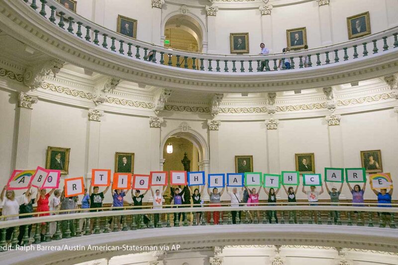 Representatives of the Trust, Respect, Access Coalition, holding multicolored signs spelling out ABORTION=HEALTHCARE, gathered in the Texas Capitol Rotunda Thursday afternoon July 27, 2017 to voice their opposition to abortion legislation being considered by the Texas House, Thursday, July 27, 2017 in Austin, Texas.