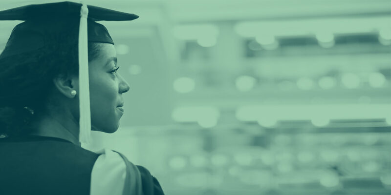 A treated image of a woman in a graduation cap.