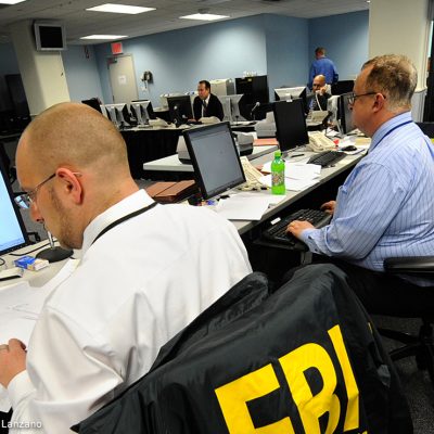 An FBI agent reads through documents.