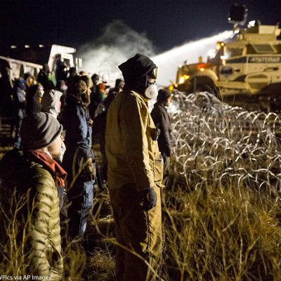 Police use a water cannon to drench opponents of the Dakota Access oil pipeline during a standoff in freezing temperatures on Backwater Bridge near the pipeline route on November 20, 2016. Cannon Ball, North Dakota