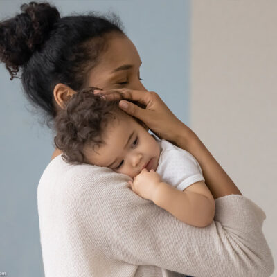 A mother holding her infant.