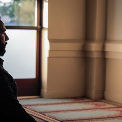 Ali Malik praying in a mosque