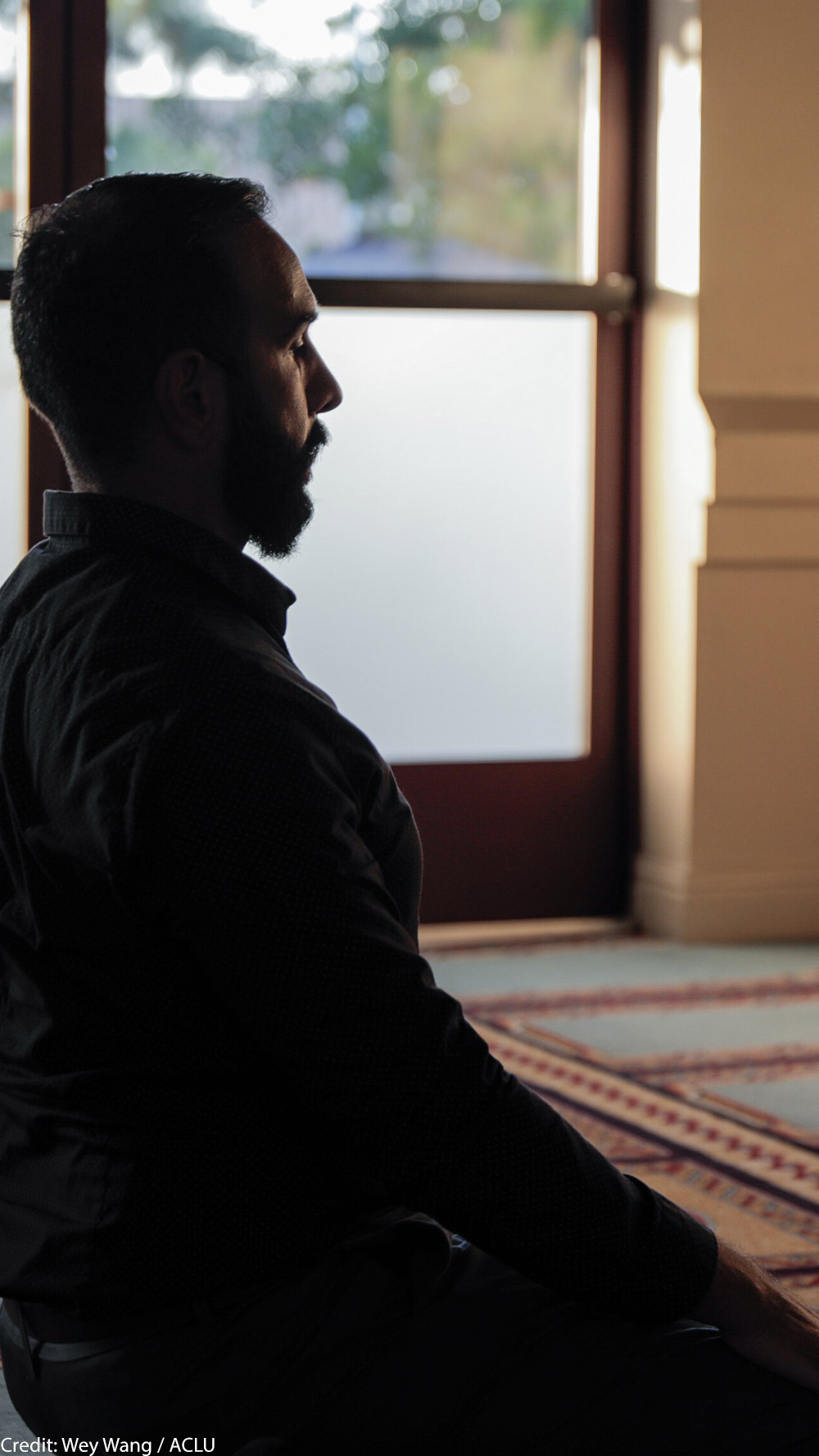 Ali Malik praying in a mosque