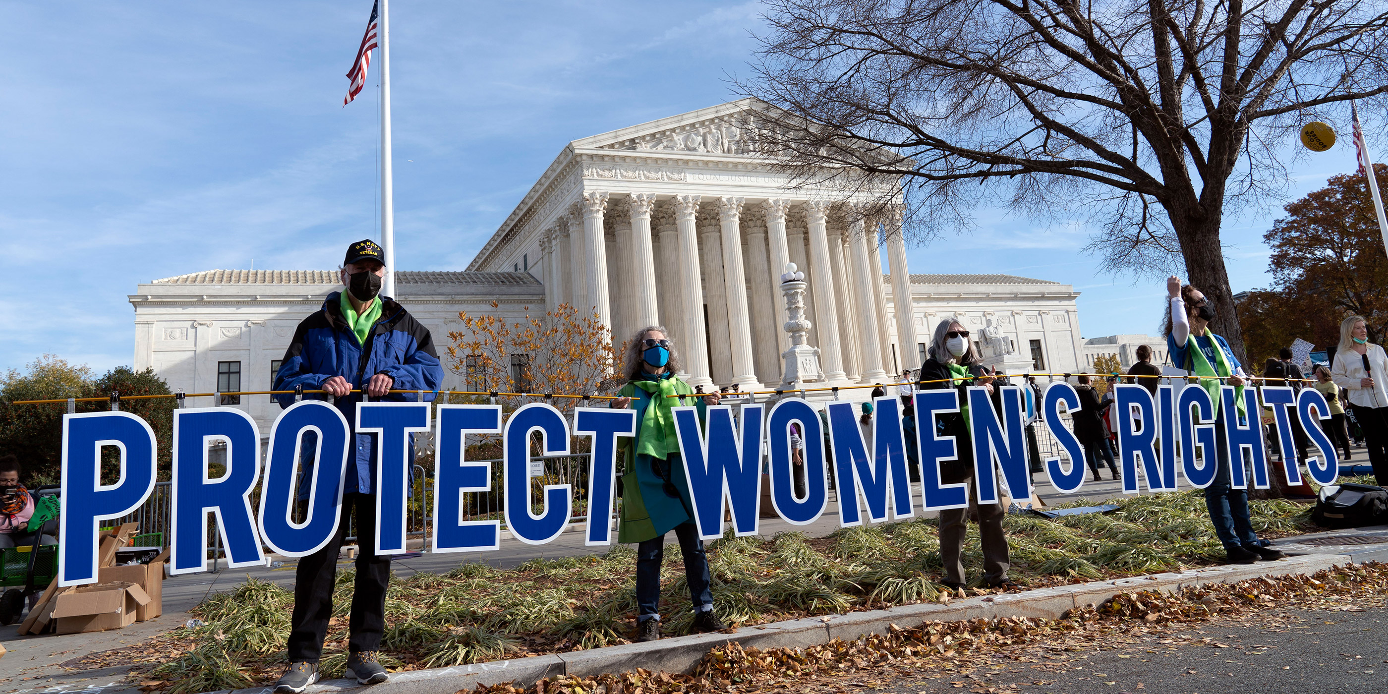Advocates demonstrate in front of the U.S. Supreme Court holding signs that say “Protect Women’s Rights.”