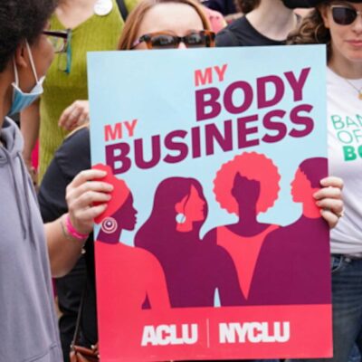 ACLU supporters marching at a reproductive rights rally.