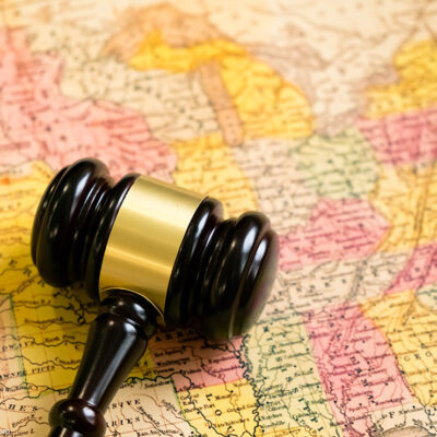 A map of the United States with a gavel on it.