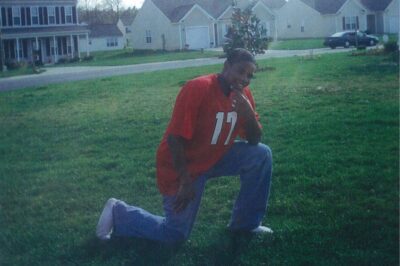 Hasson Bacote posing in a football jersey.