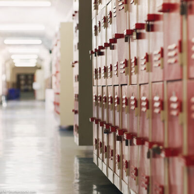 A shot of an empty corridor in a high school.