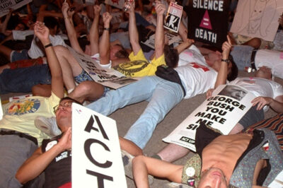 Demonstrators perform a die-in symbolizing the amount of people dying from AIDS, Monday, August 17, 1992, in Houston. Hundreds of police and gay rights activists clashed outside the Republican National Convention Monday night as protesters sought to block a street near the Astrodome.