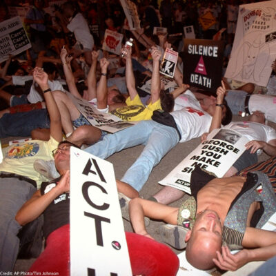 Demonstrators perform a die-in symbolizing the amount of people dying from AIDS, Monday, August 17, 1992, in Houston. Hundreds of police and gay rights activists clashed outside the Republican National Convention Monday night as protesters sought to block a street near the Astrodome.