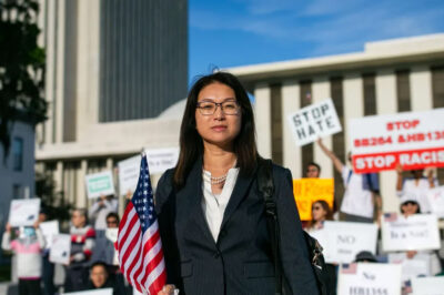 Echo King, an attorney from Orlando, Florida, stands in front of protesters who rallied in opposition to SB264 and HB1355 in front of the Capitol on Wednesday, April 19, 2023.