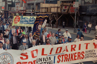 Union workers march on Wednesday, May 3, 1990 in Midtown New York in solidarity with striking workers of Greyhound, Eastern Airlines and a Brooklyn clothing manufacturer. The march began in the afternoon at the Port Authority Bus terminal and moved uptown to Rockefeller Center.