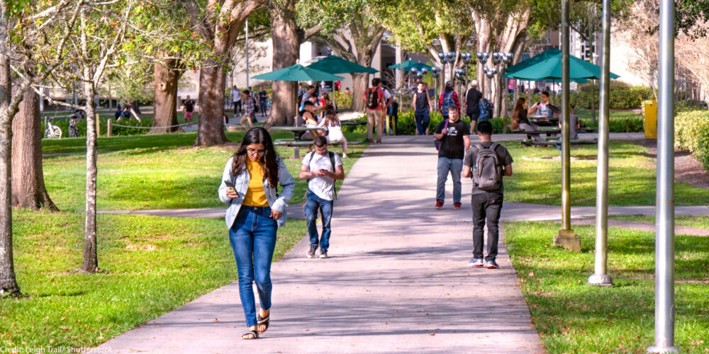 Students walking on a college campus.