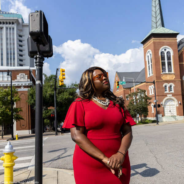 Khadidah Stone stands on the dividing line between her old Alabama congressional District 7, to her right with River City Church, and her new district, District 2, to her left, in downtown Montgomery, Ala., Sept. 20, 2022. The Supreme Court’s decision last June siding with Black voters on a redistricting case in Alabama gave Democrats and voting rights activists a surprise opportunity ahead of the 2024 elections to have congressional maps redrawn in a handful of states. Fast forward three months and maps in Alabama and other states that could produce more districts represented by Black lawmakers still don’t exist.