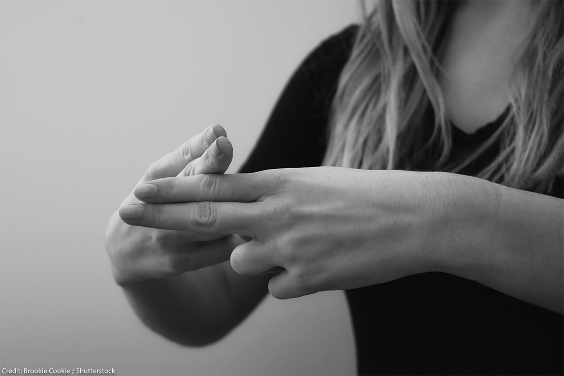 A closeup of an American Sign Language interpreter's hands as they sign.