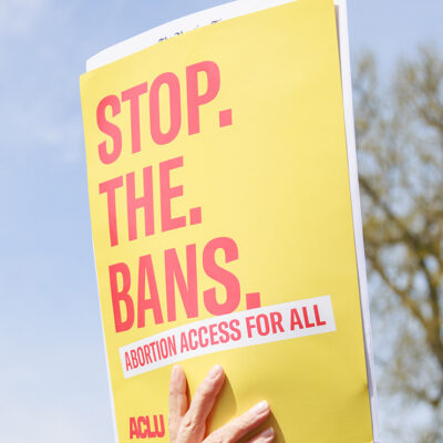A protest sign that says Stop the Bans.